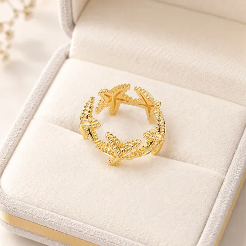 Anillo Estrellas de Mar Ajustable con Baño de Rodio